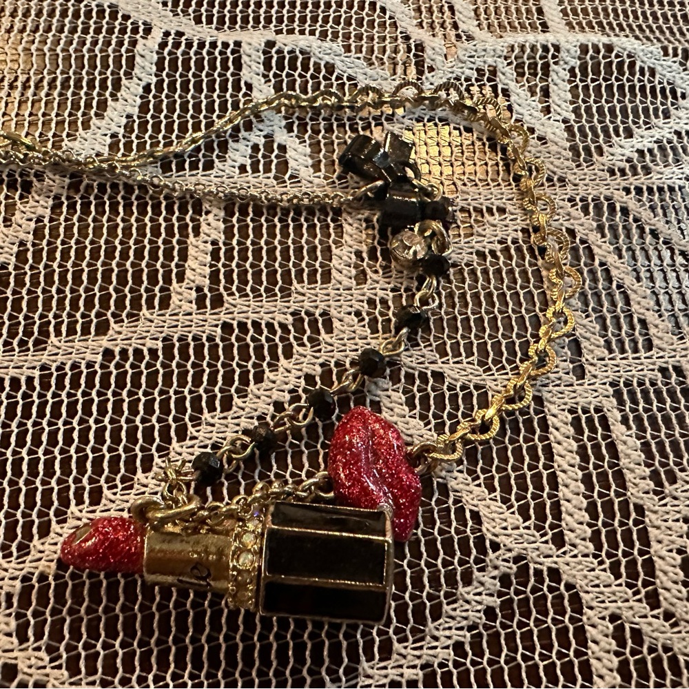 Betsey Johnson lipstick necklace.